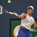 Janice Tjen memukul forehand saat bertanding.